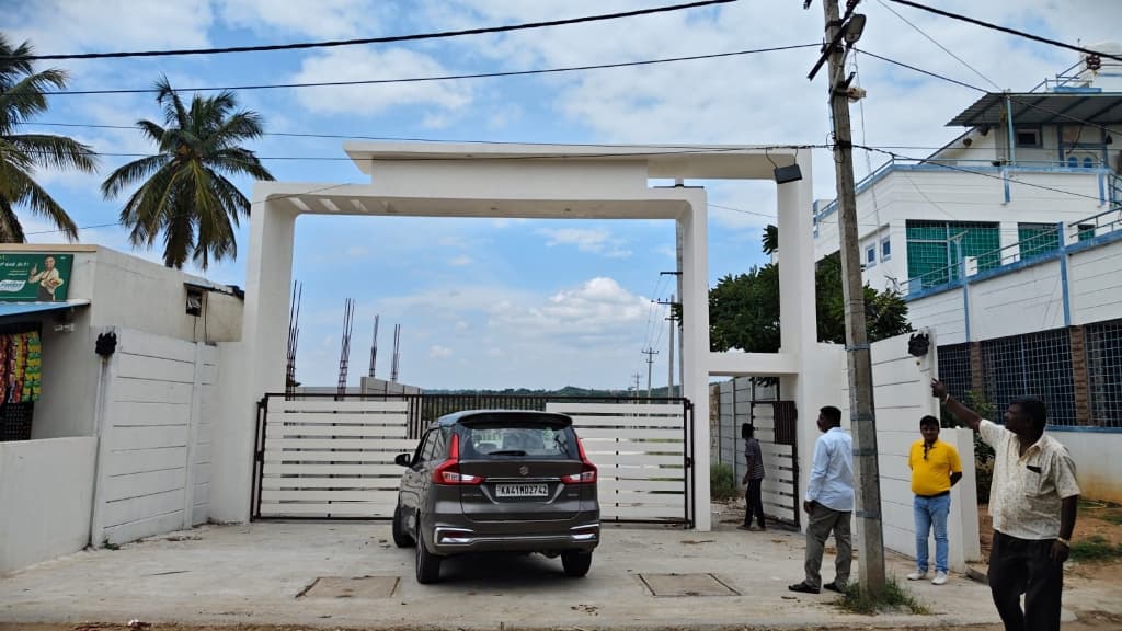 Nagaraju Farm Land grand modern entrance arch with security gate and visitors