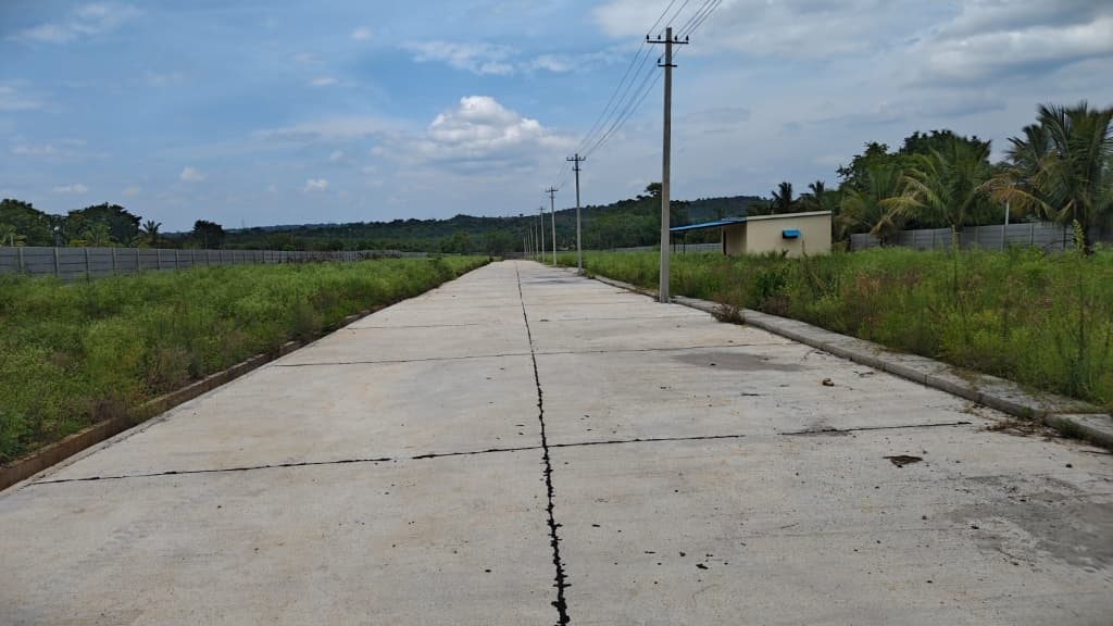 Nagaraju Farm Land concrete internal road and electrical poles in Thippuru near Kumbalagudu